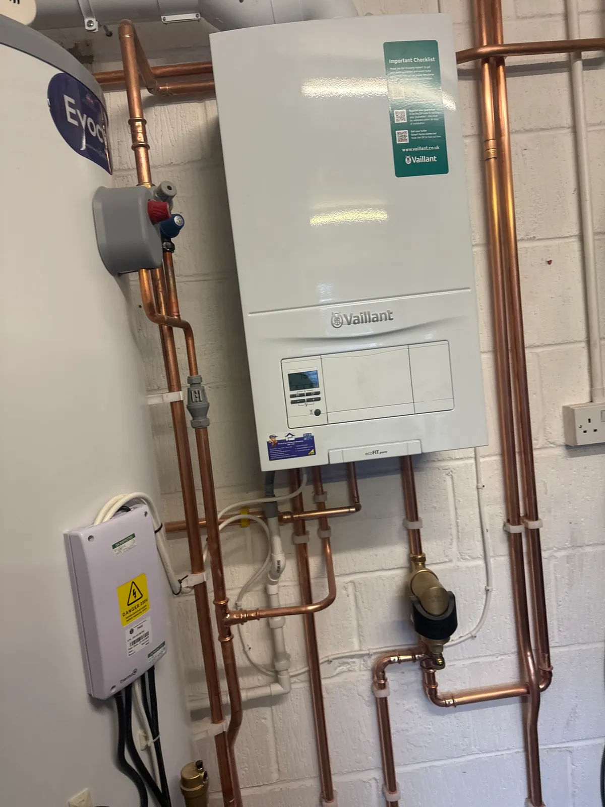 woman in blue long sleeve shirt sitting beside man in blue dress shirt